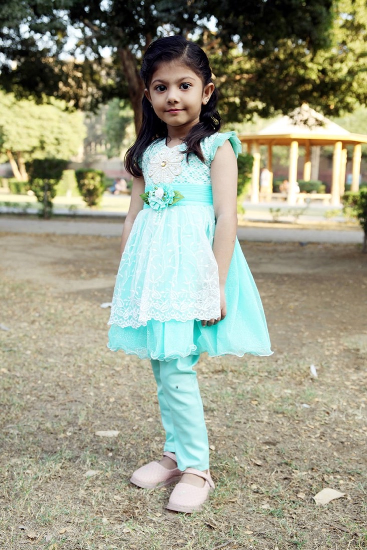 Girls' blue party frock manufactured by Faraak garment factory Karachi